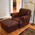 F04. Ethan Allen leather chair and ottoman. 